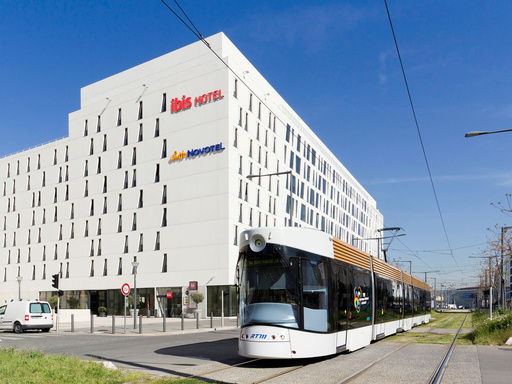 The facade of the ibis Marseille Centre Euromed hotel and the tram