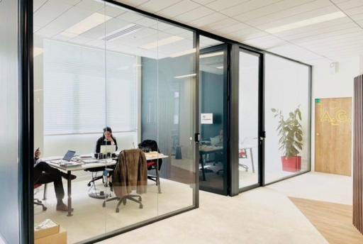 The glass-walled offices of the Obratori coworking space