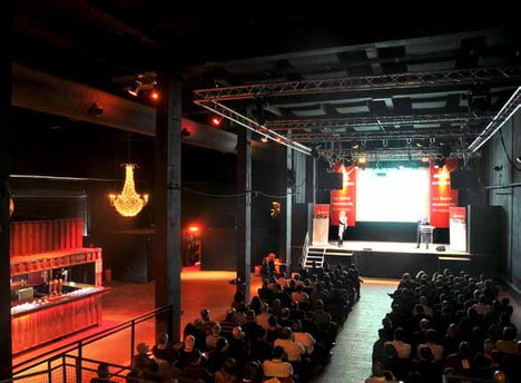 Plenary setup with stage and giant screen